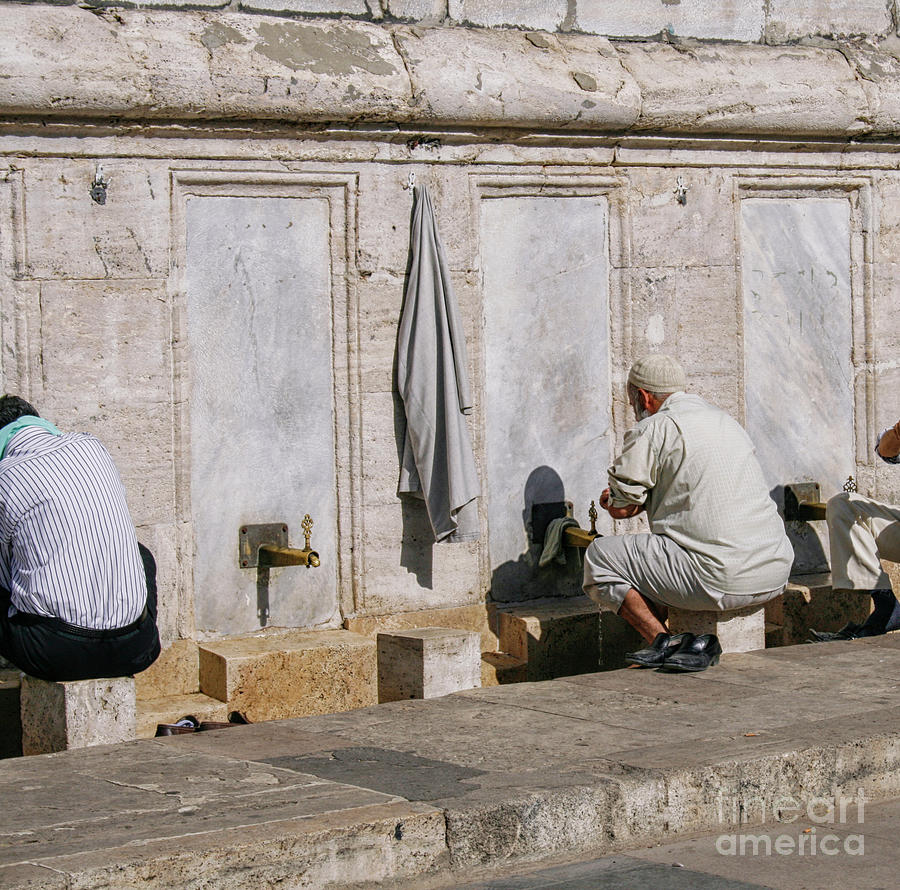 Religious men washing feet near mosque Photograph by Patricia Hofmeester