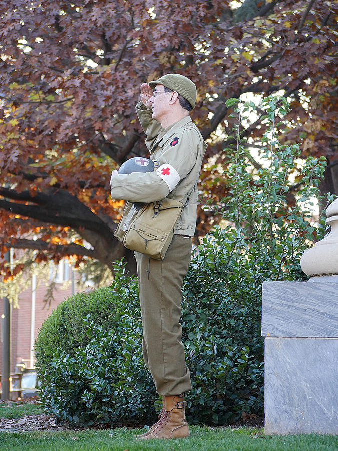 Remembrance - A Medic Salutes the Flag Photograph by Richard Reeve
