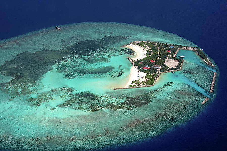 Resort in the Ocean. Aerial Journey around Maldives Photograph by Jenny Rainbow