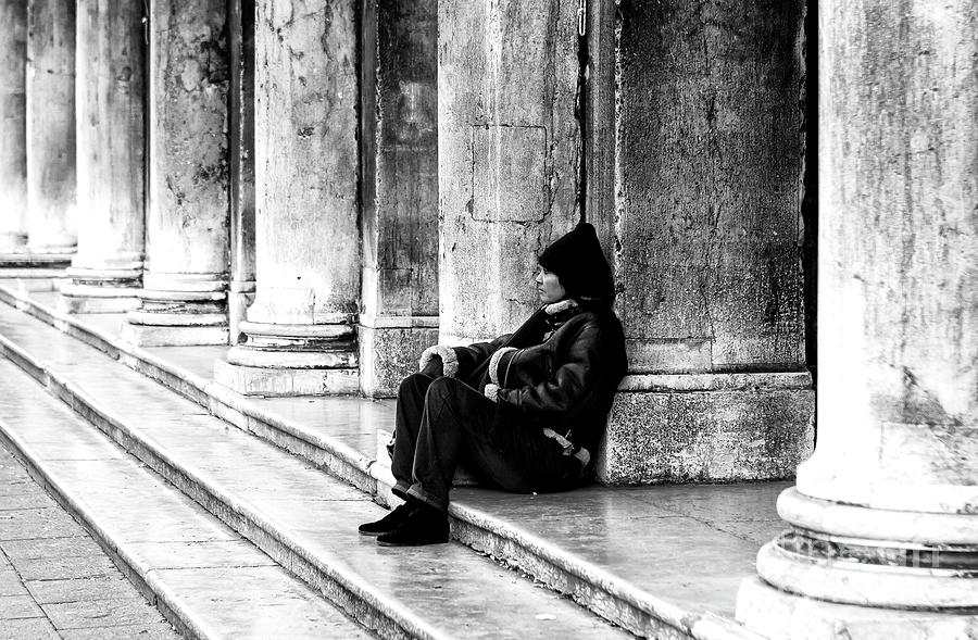 Resting at St. Marks Square in Venice Photograph by John Rizzuto