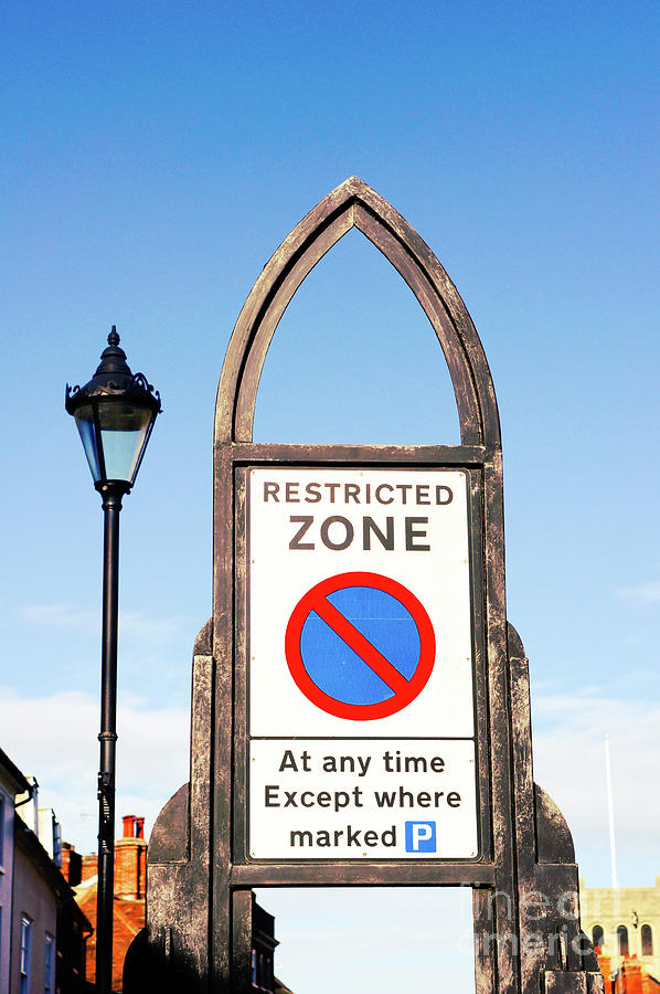 Restricted parking sign Photograph by Tom Gowanlock
