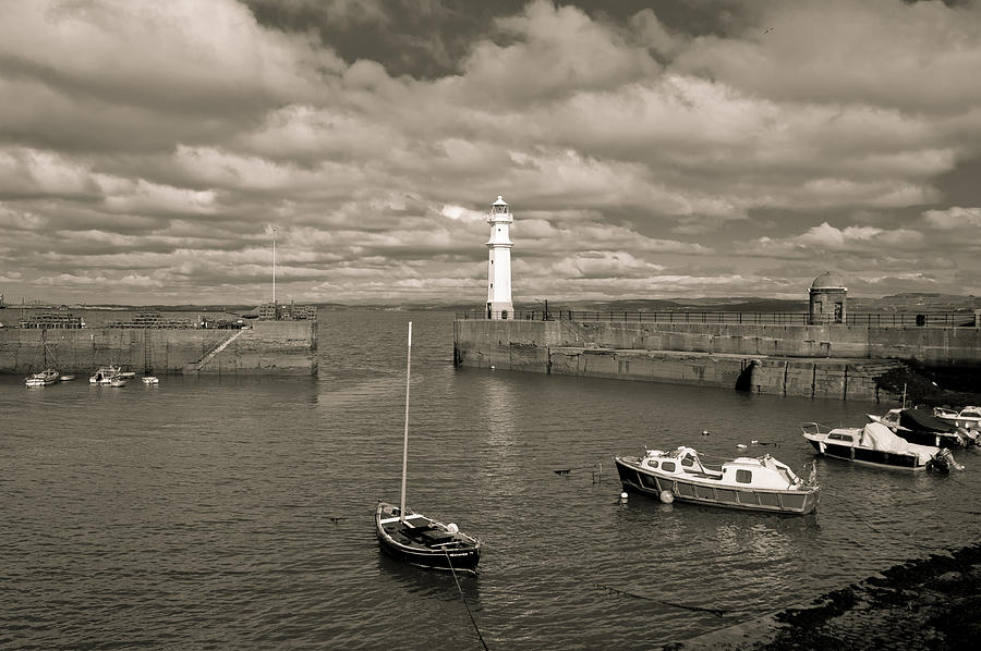 Retro harbour and old lighthouse. Photograph by Elena Perelman