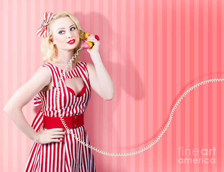 Retro housewife in 50s fashion on vintage phone Photograph by Jorgo Photography
