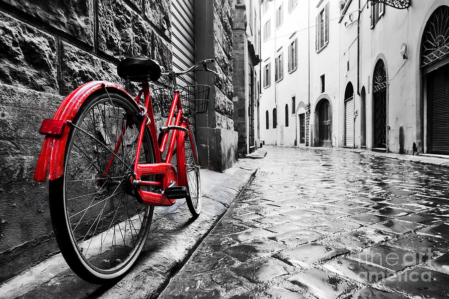Retro vintage red bike on cobblestone street in the old town Photograph by Michal Bednarek