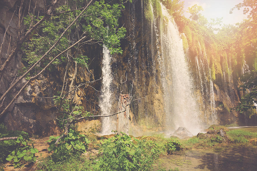 Retro Waterfall With Sunlight With Vintage Film Style Photograph