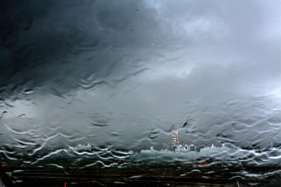 Rain over town Photograph by David Matthews