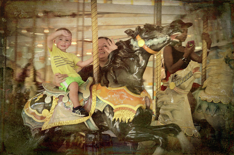 Riding Along On A Carousel Photograph