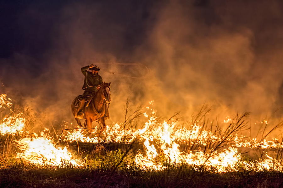 Riding Through The Flames Photograph by Alan Hutchins
