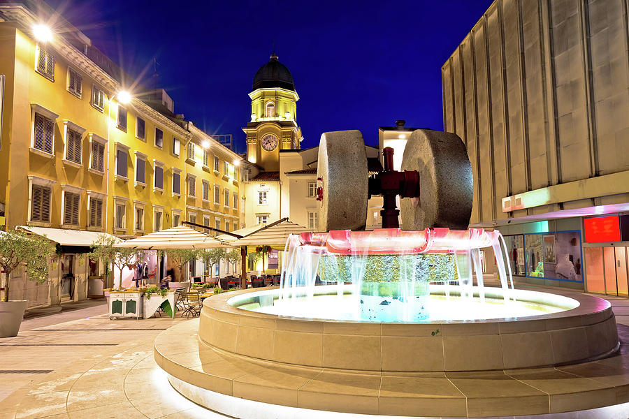 Rijeka square and fountain evening view with clock tower gate Photograph by Brch Photography