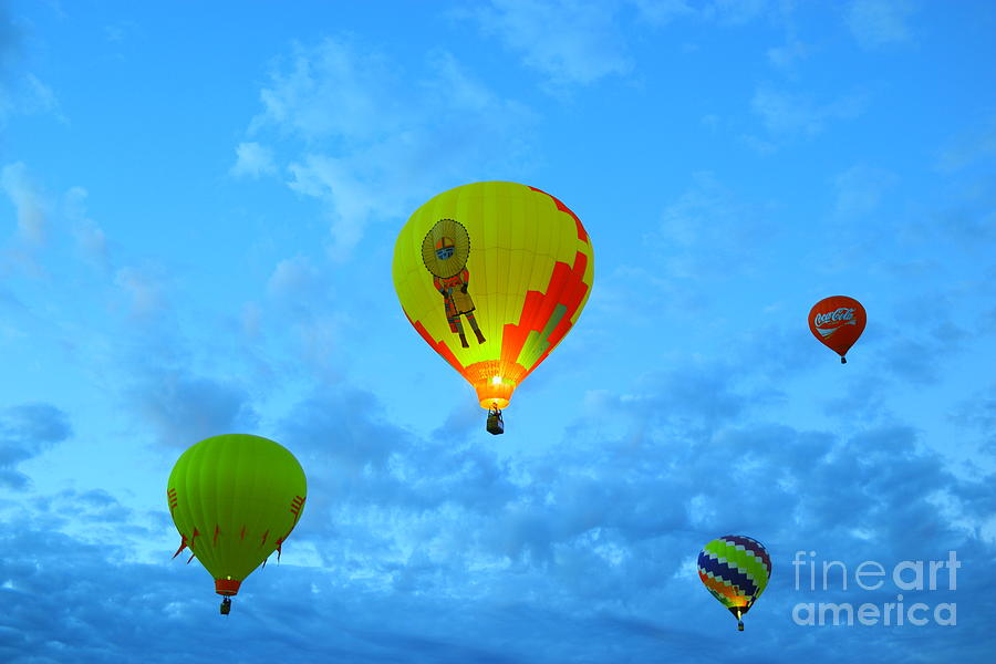 Balloons Photograph - Rising in the early morning sky by Jeff Swan