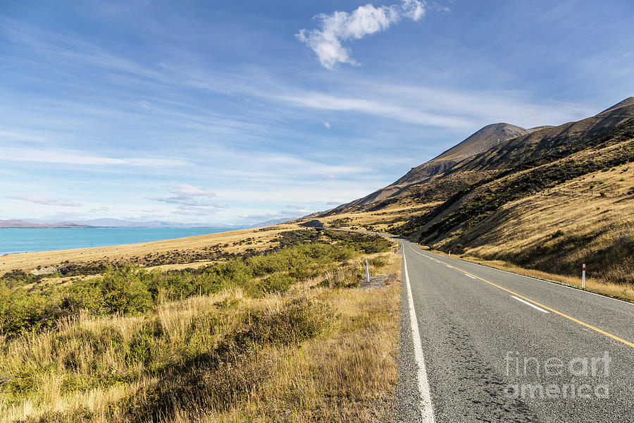 Road along lake Pukaki off Mt Cook in New Zealand Photograph by Didier Marti