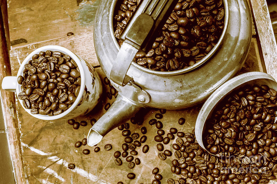 Roasted coffee beans in kettle and cup Photograph by Jorgo Photography