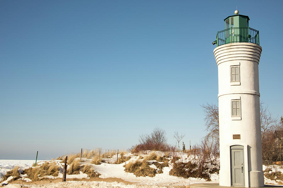 Robert H Manning Lighthouse on sandy beach, Empire, Michigan in  Photograph by Karen Foley