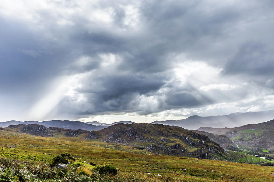 Rock formation landscape with clouds and sun rays in Ireland Photograph by Semmick Photo