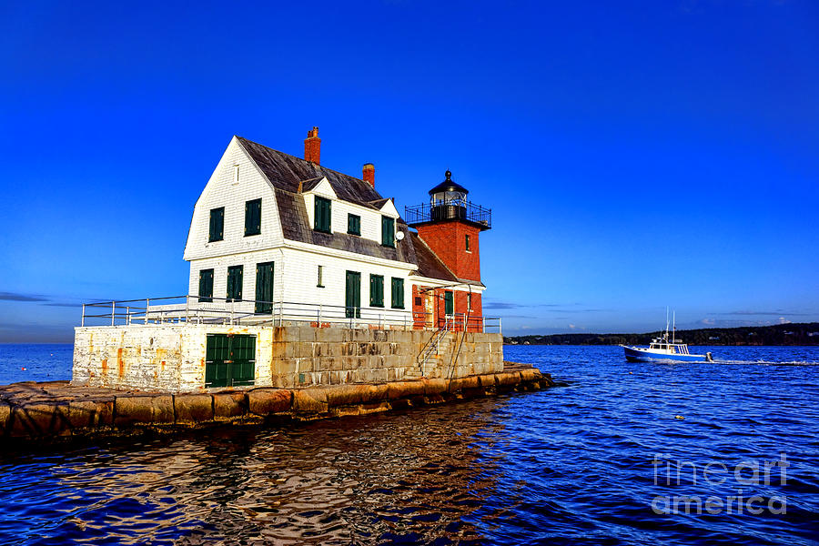 Rockland Harbor Light and Fishing Boat Photograph by Olivier Le Queinec