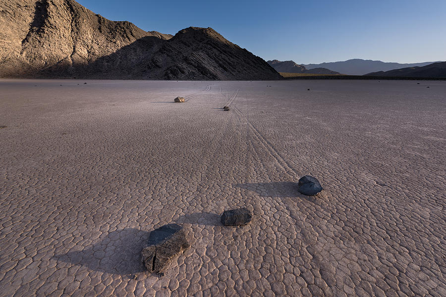 Sunset Photograph - Rocks on the Racetrack Death Valley by Steve Gadomski