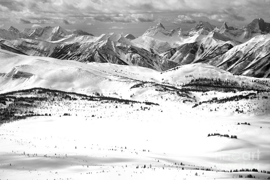 Rocky Mountain Peaks Towering Over The Slopes Of Sunshne Black And White Photograph by Adam Jewell