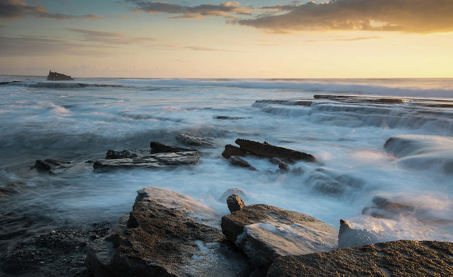 Rocky seashore during sunset Photograph by Michalakis Ppalis