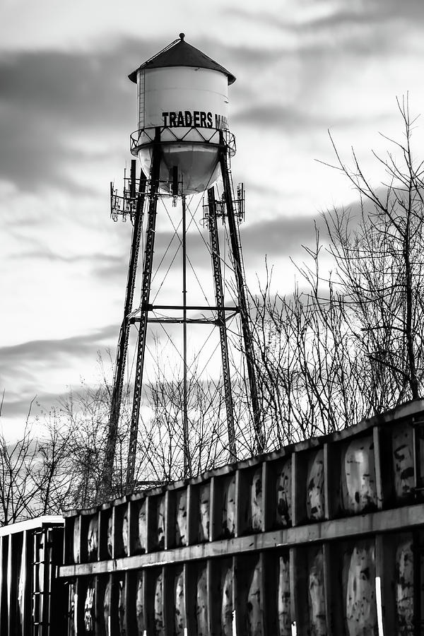 Black And White Photograph - Rogers Arkansas Water Tower Along the Tracks - Black and White Edition by Gregory Ballos