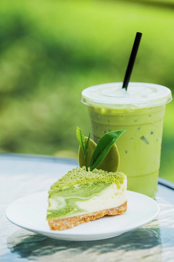 Roll cake and ice green tea Photograph by Anek Suwannaphoom