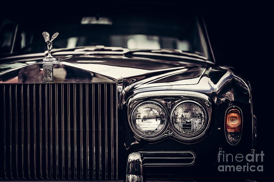 Rolls-Royce - classic British car on black background, close-up. Photograph by Michal Bednarek