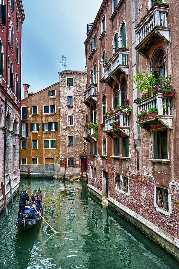 Gondola Ride Surrounded By Vintage Buildings In Venice Italy