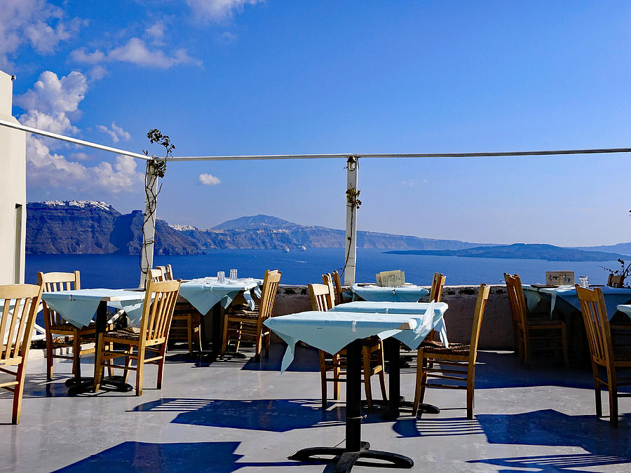 Rooftop Restaurant With A View In The Town Of Oia On The Island Of Santorini Photograph by Rick Rosenshein