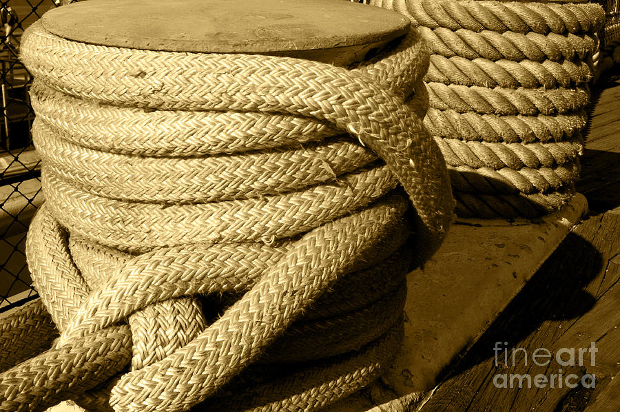 Rope tied to a large ship Photograph by Micah May
