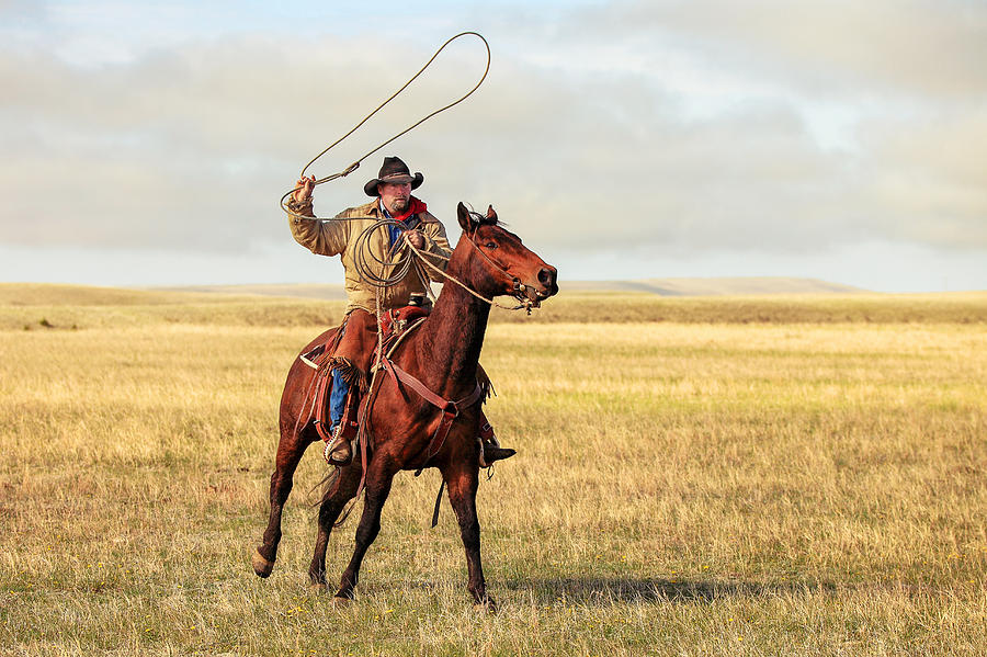 Roping on the High Plains Photograph by Todd Klassy