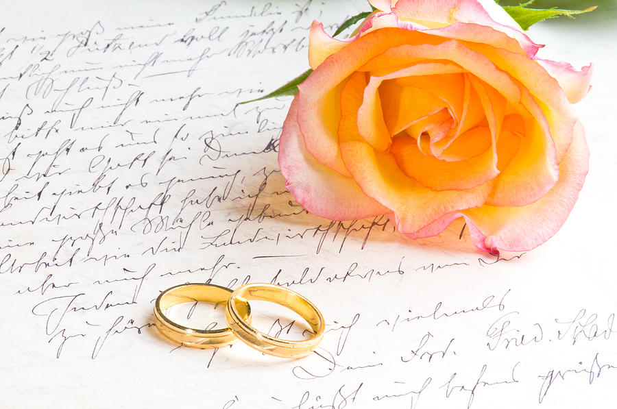 Rose and two rings over handwritten letter Photograph by U Schade