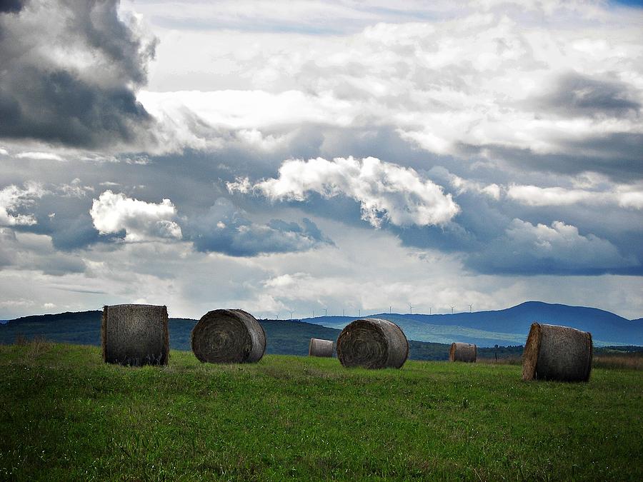Nature Photograph - Round Bales Under A Cloudy Sky by Joy Nichols