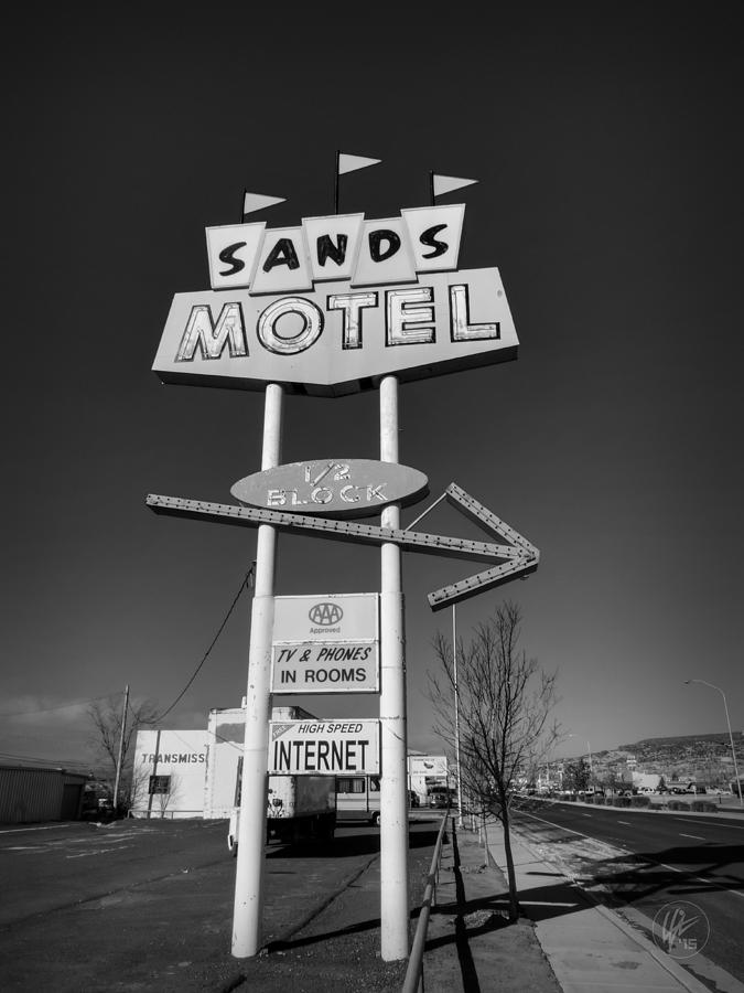 Black And White Photograph - Route 66 - Sands Motel Sign 001 BW by Lance Vaughn