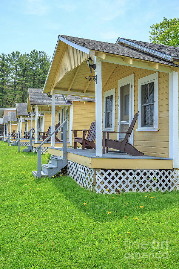 Row of vintage yellow rental cottages Photograph by Edward Fielding