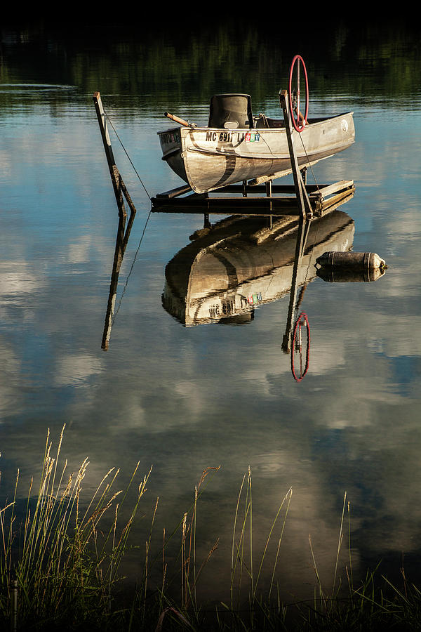 Rowboat in Early Morning Sunlight with Shore Grass Photograph by Randall Nyhof