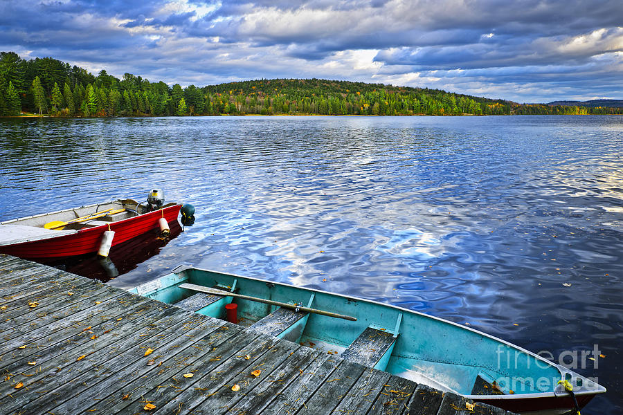 Boat Photograph - Rowboats on lake at dusk by Elena Elisseeva