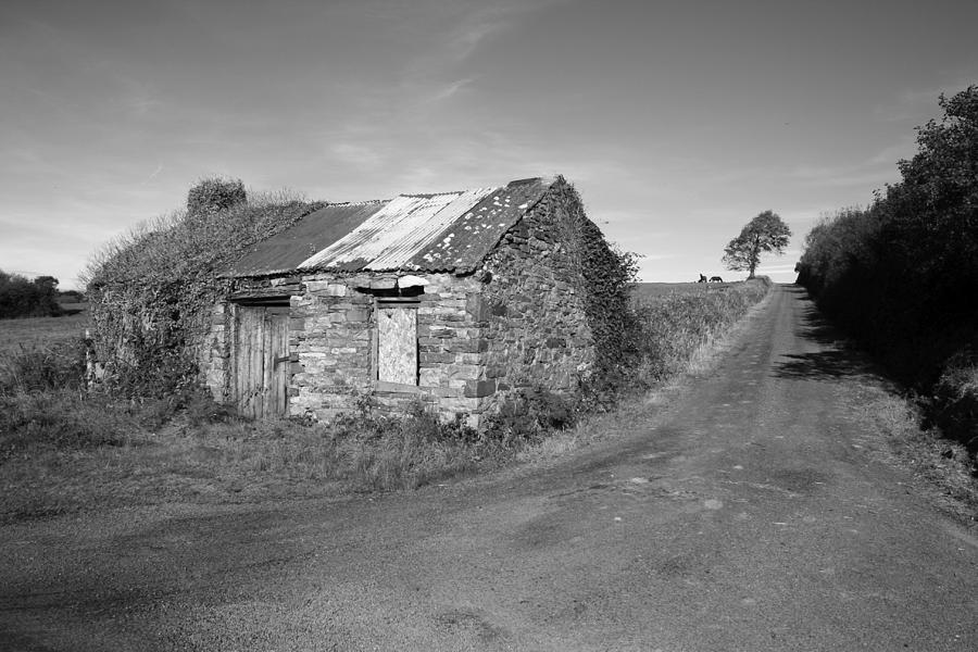 Black And White Photograph - Ruined Irish Cottage by John Quinn