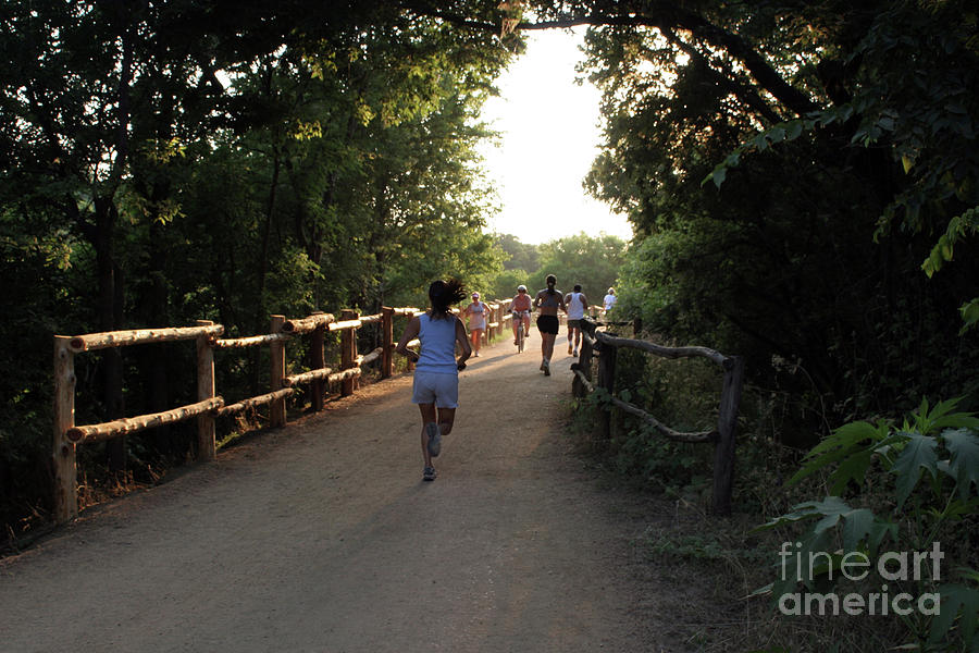 Austin Photograph - Runners and bikers exercise on the town lake hike and bike trail in austin texas by Dan Herron