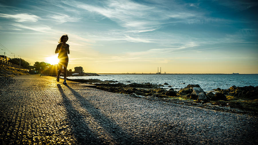 Running at sunset - Dublin, Ireland - Color street photography Photograph by Giuseppe Milo