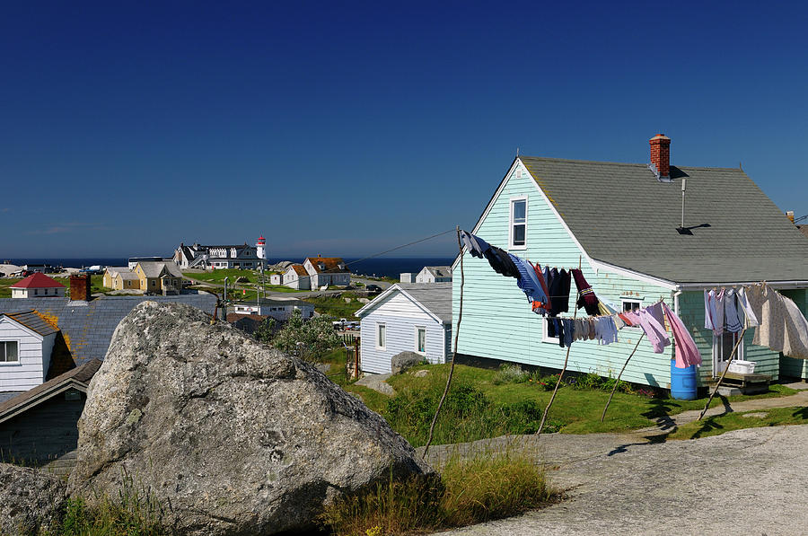 Rural fishing village houses with laundry and the lighthouse at ...