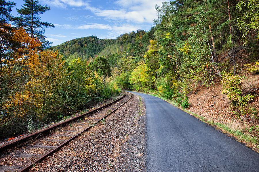 Rural Road and Railway Track Along Autumn Forest Photograph by Artur Bogacki
