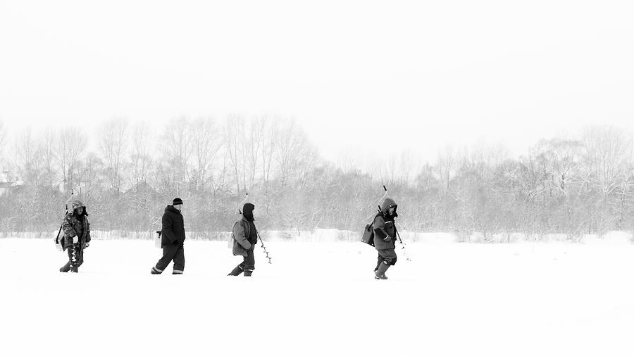 Russian Fishermen Ice Fishing in Winter Photograph by John Williams