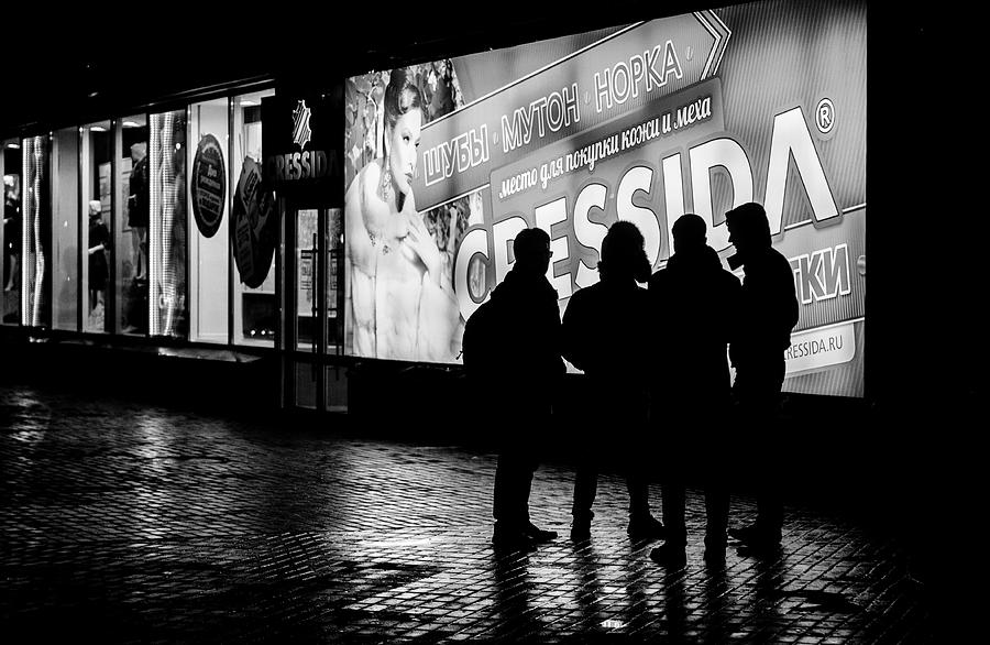 Russian Teens at Night Outside a Shopping Center Photograph by John Williams