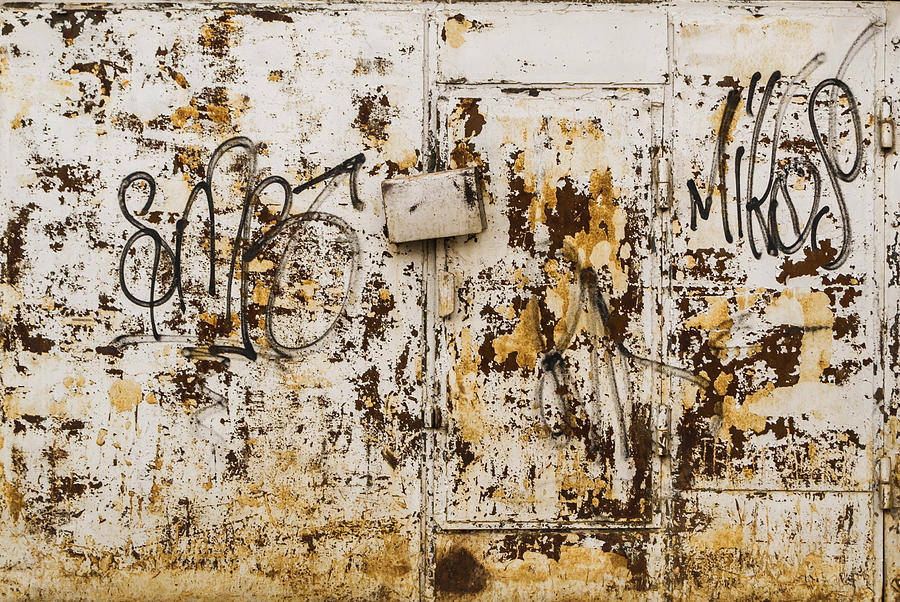 Rust on Grey Metal with Urban Vandal Art Photograph by John Williams