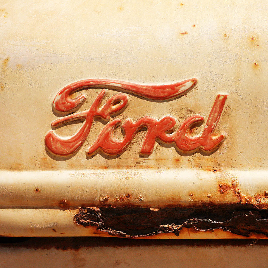Rusted Tractor Logo Photograph by Art Block Collections