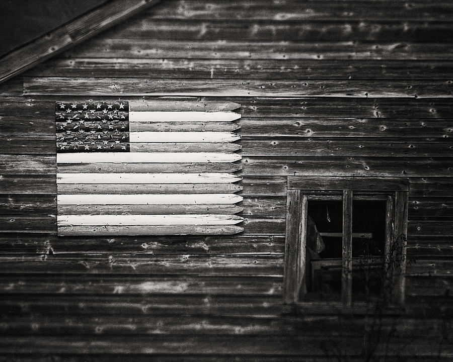 Black And White Photograph - Rustic Black and White American Flag on a Weathered Barn by Lisa R