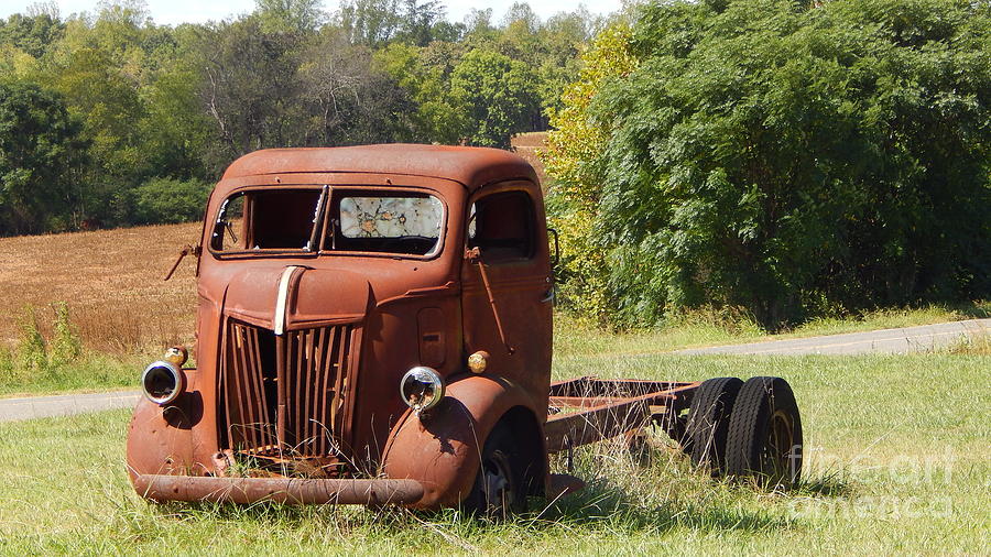 Rustic bullet hole truck. Photograph by Sandra Underwood - Pixels