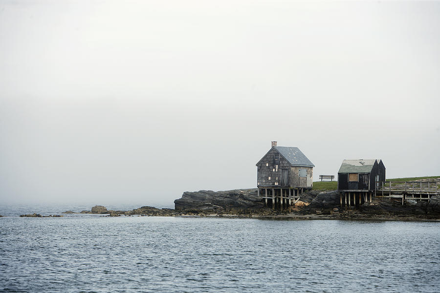 Cabin Photograph - Rustic Cabin On Stilts On Rocky Shore by Gillham Studios