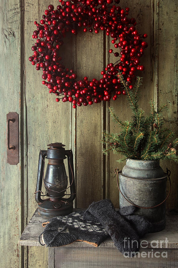 Christmas Photograph - Rustic holiday scene with lamp on bench with wreath by Sandra Cunningham