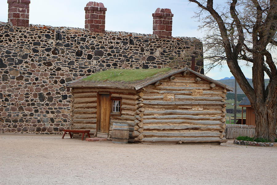 Rustic Log Cabin Outside of Rock Wall Photograph by Colleen Cornelius