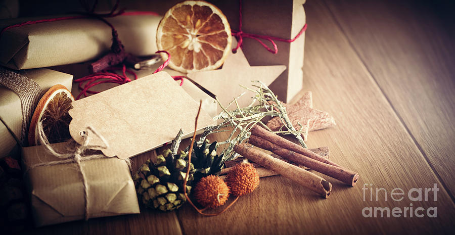 Christmas Photograph - Rustic retro gift, present boxes with decorations. Christmas time, eco paper wrap. by Michal Bednarek